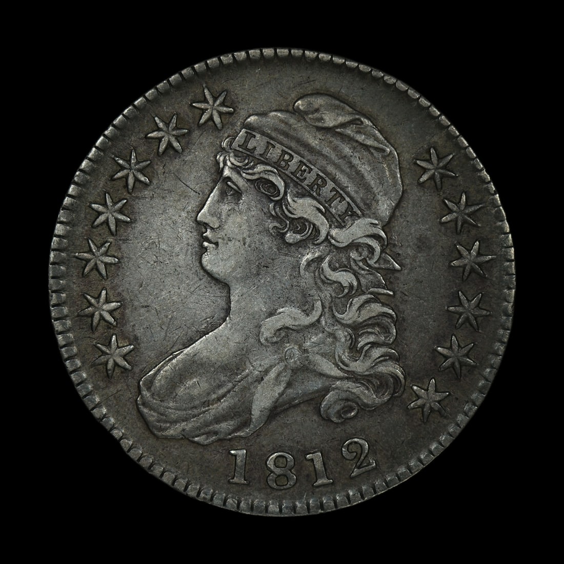 1812 Capped Bust Half Dollar XF+ WOW BIG COIN!: (BBGJ) Early date capped bust half with a plump cheek and steely original look.