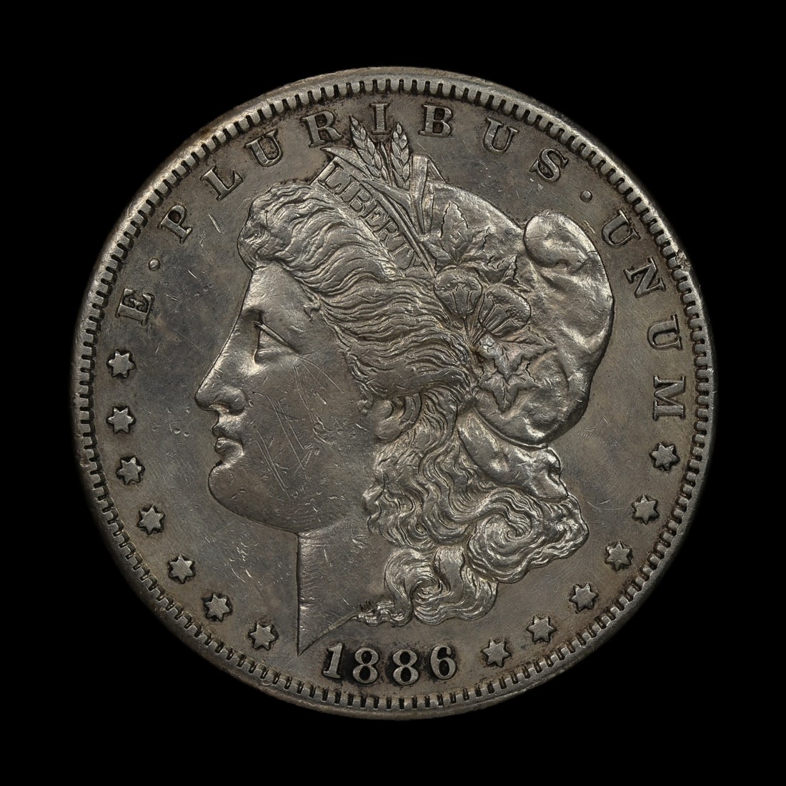 1886 S Morgan Silver Dollar AU/UNC Details: (PZLM) Appears to be whizzed. Tough date to find this much detail though.