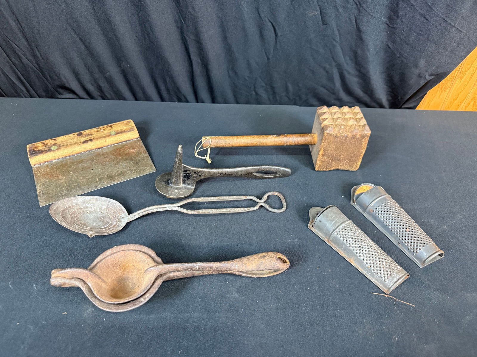 Lot of 7 Kitchen Tools: Lot of 7 Kitchen Tools. Includes 2 meat tenderizers, 2 nutmeg graters, 1 citrus juicer, 1 bench scraper, and 1 multi volume measuring spoon