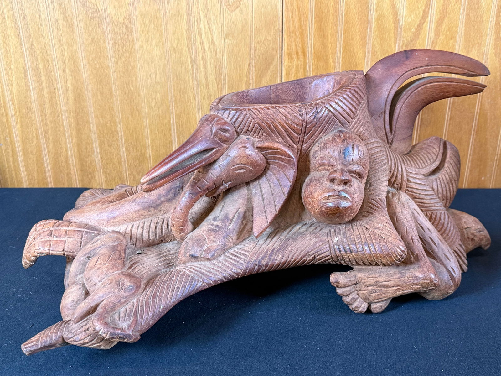 Hand carved wooden African sculpture: Hand carved wooden African sculpture with human face and elephants