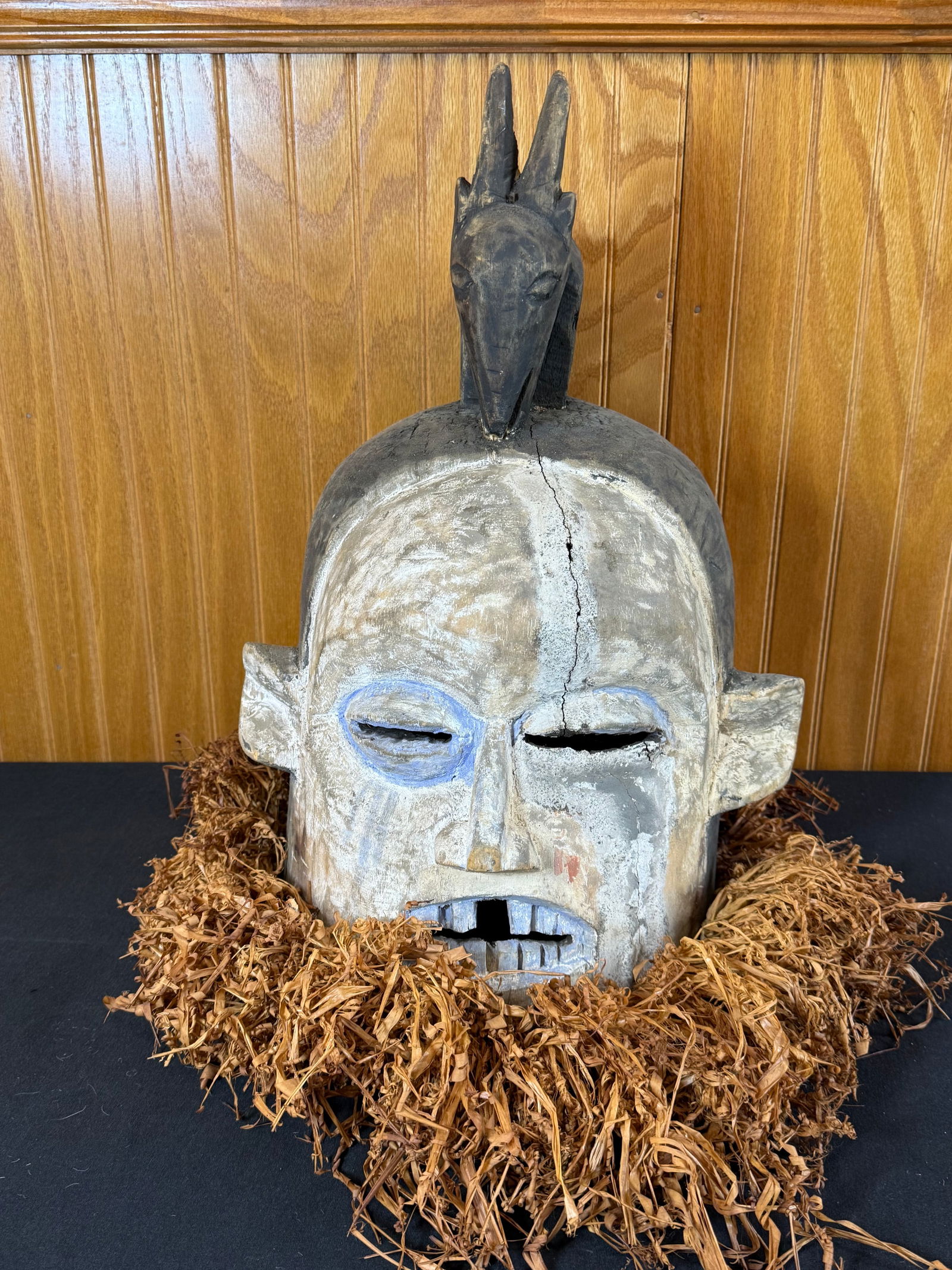 Hand carved hand painted wooden African mask w/raffia straw: Hand carved hand painted wooden African mask w/raffia straw