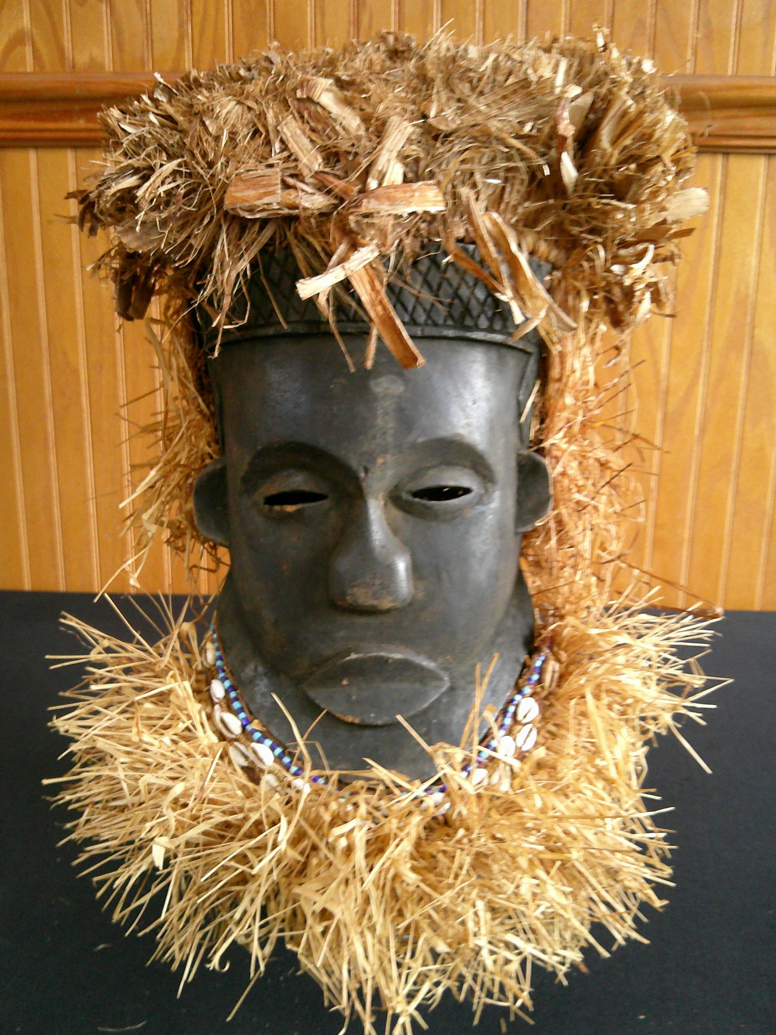 Hand carved wooden African mask w/raffia straw: Hand carved wooden African mask w/raffia straw