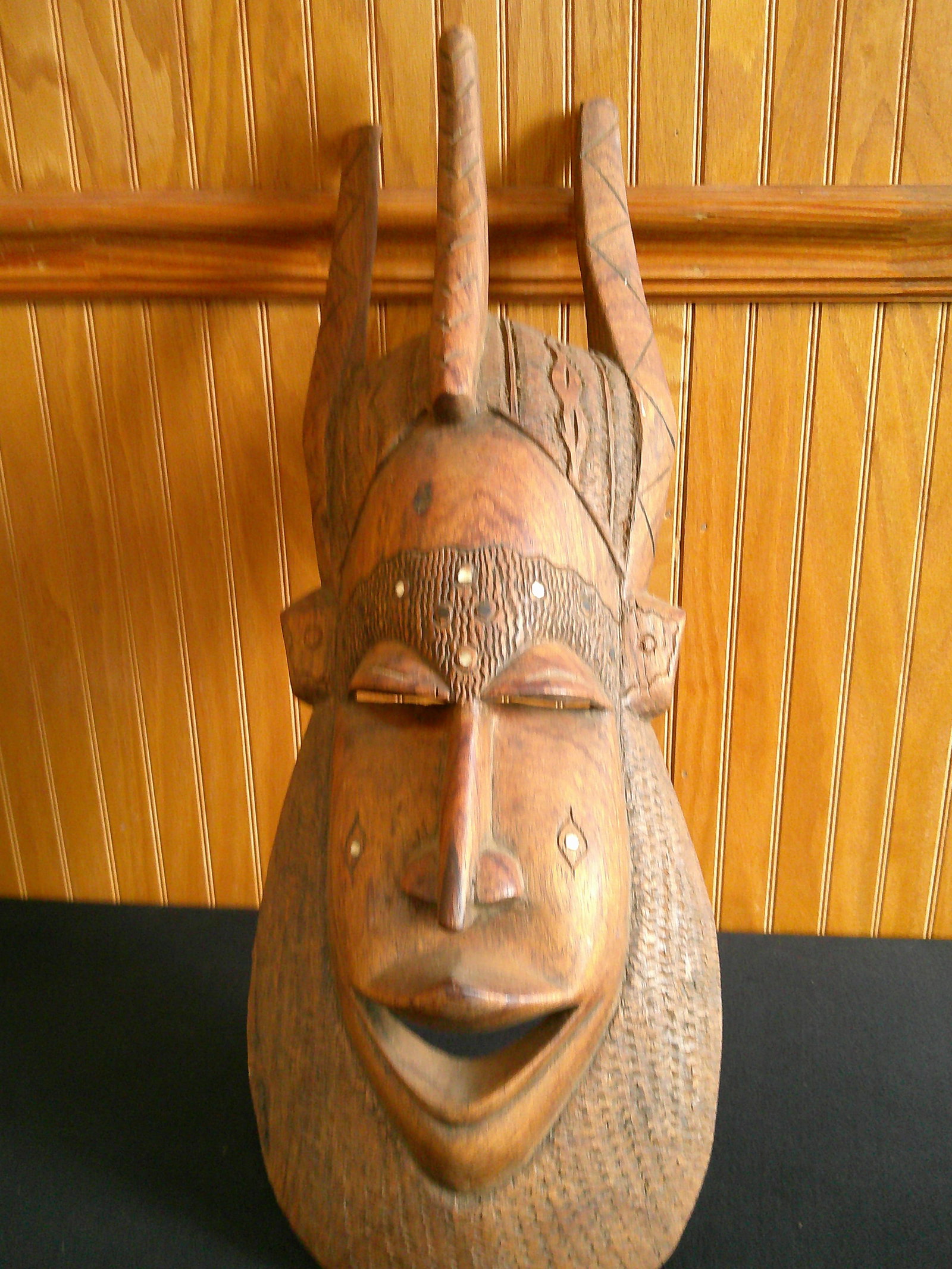 Hand carved wooden African mask: Hand carved wooden African mask. Mother of pearl inlay