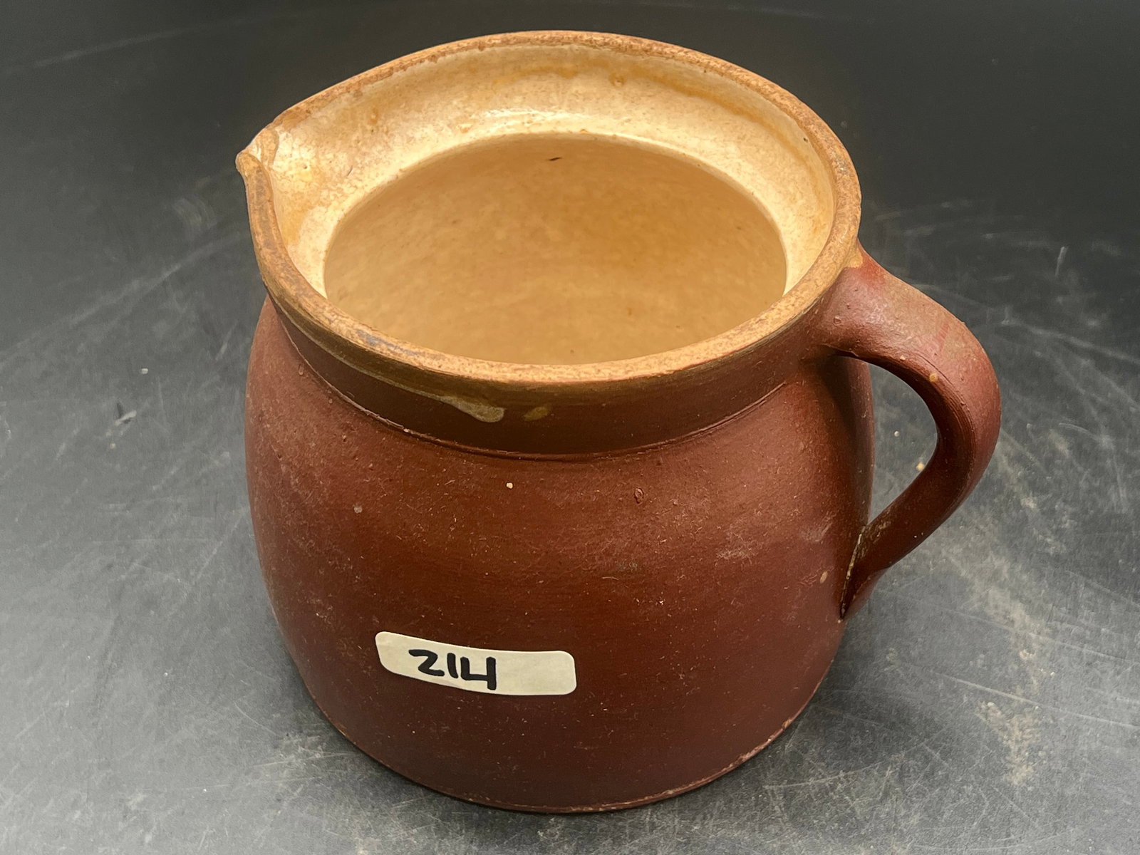 Stoneware Pitcher: Stoneware Pitcher. Brown and tan glaze (207)