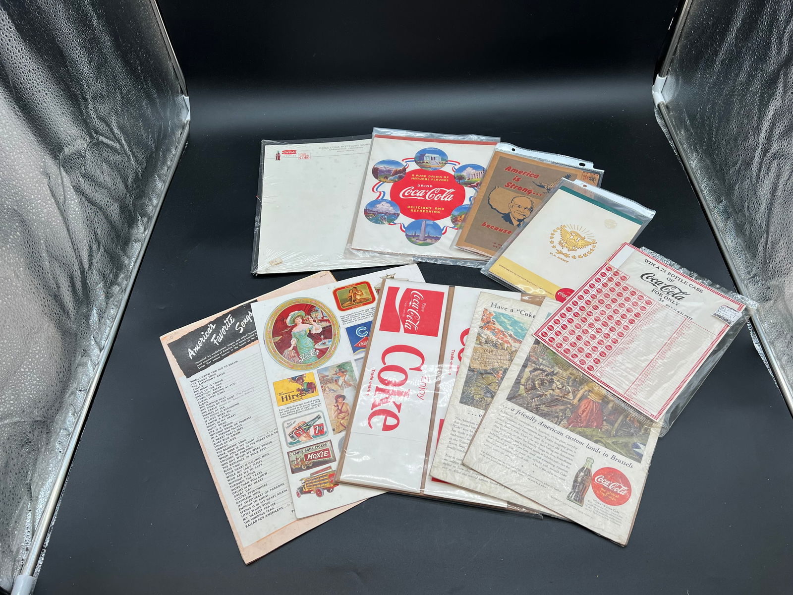Lot of 10 Coca Cola Memorabilia: Lot of 10 Coca Cola Memorabilia. Advertising pads, writing board, games, hats, and posters