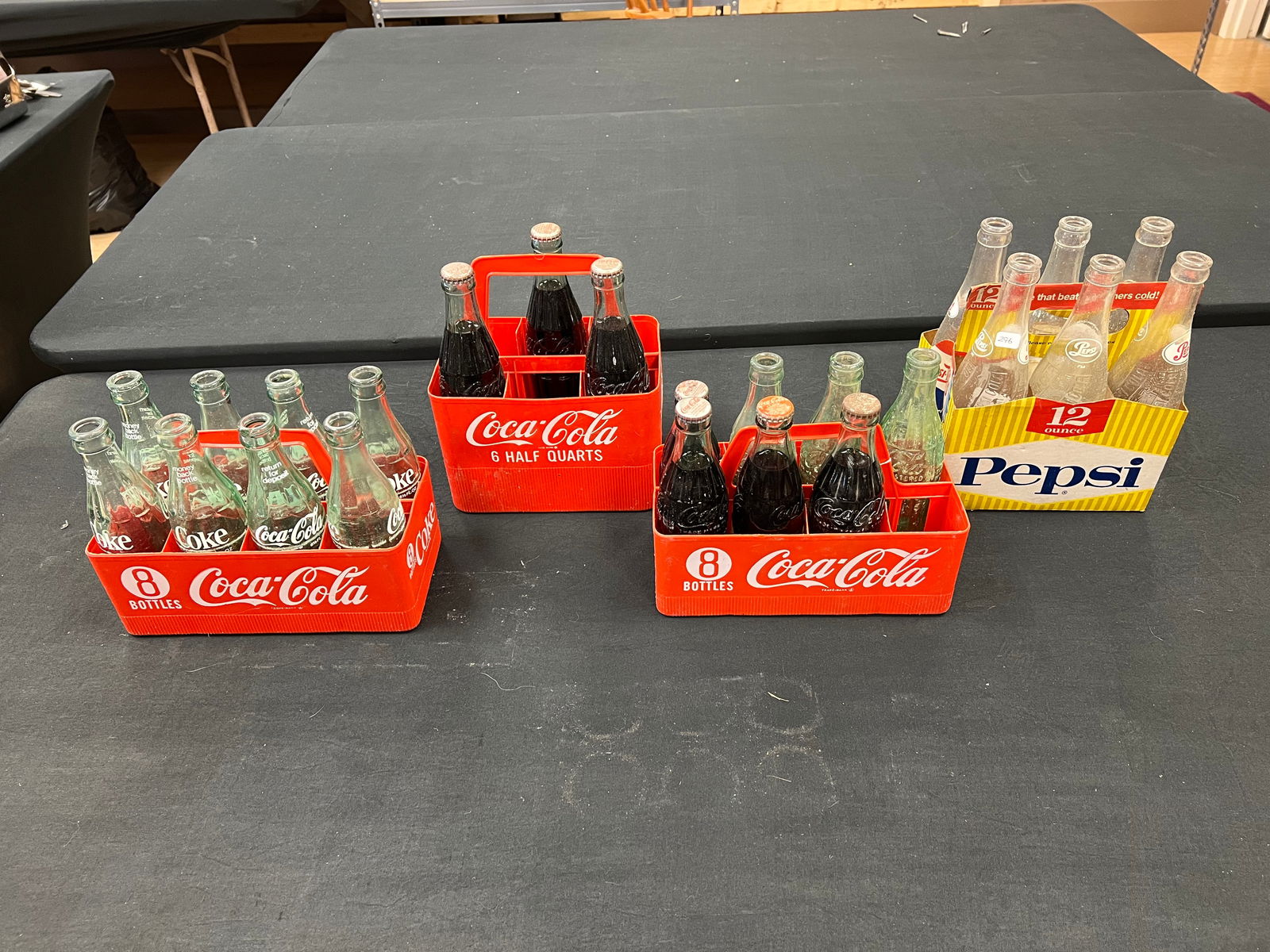 Lot of 4 Early 6 Packs of Bottles: Lot of 4 Early 6 Packs of Bottles. 6 pack of 12 oz Pepsi, 8 pack of 6.5 oz Coca Cola w/ plastic carrier, 3 pack of 10 oz Coca Cola w/plastic carrier, and 7 pack of 7 oz and 6.5 oz Coca Cola in plastic