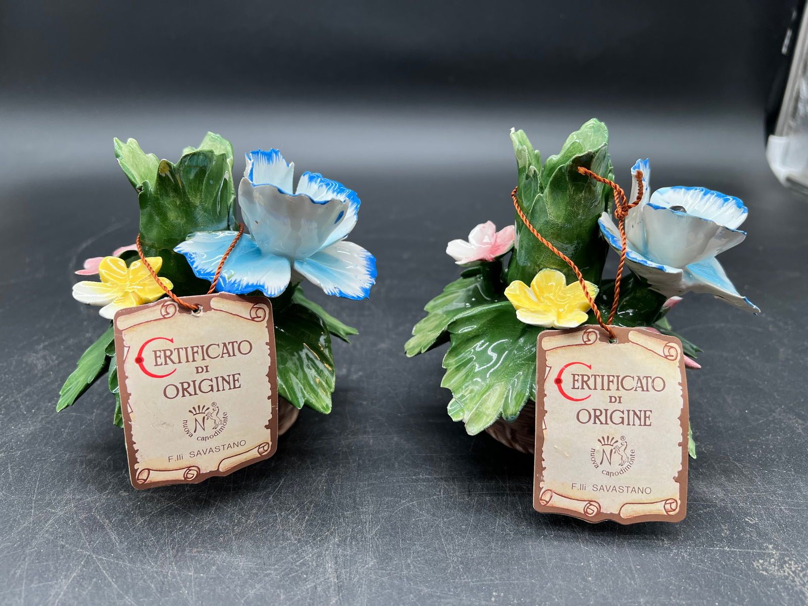 Pair of Capodimonte Candle Holders: Pair of Capodimonte Candle Holders. Comes with original tags. Signature on bottom