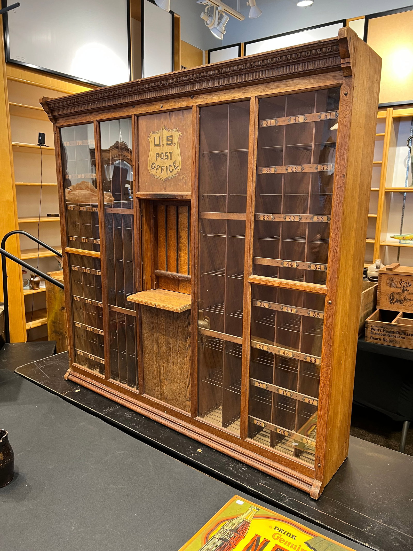 Waddel Company Sub-Postal Cabinet Teller Booth: Sub-Postal Cabinet. Made from Oak. Cash and stamp drawers. Fantastic condition with original finish and graphics. Wavey glass. Outstanding condition.