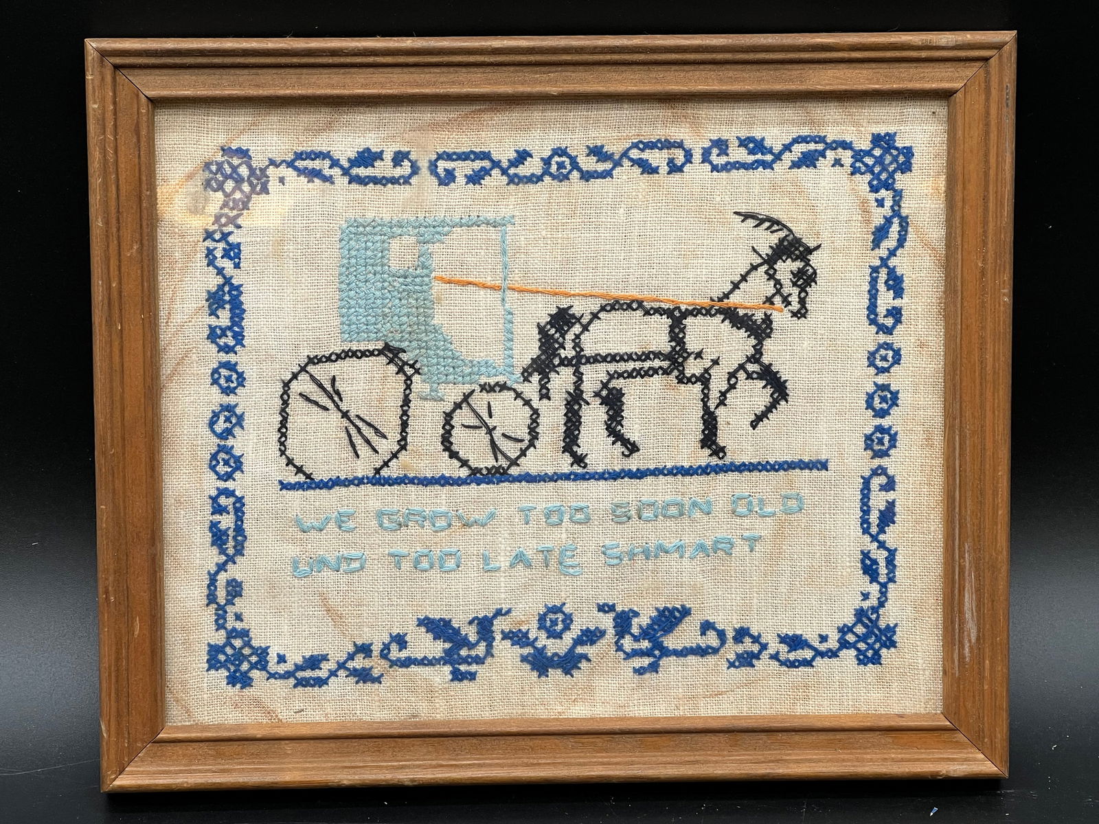 Early Needlepoint in Frame: Early Needlepoint in Frame. “We grow too soon old und too late shmart”