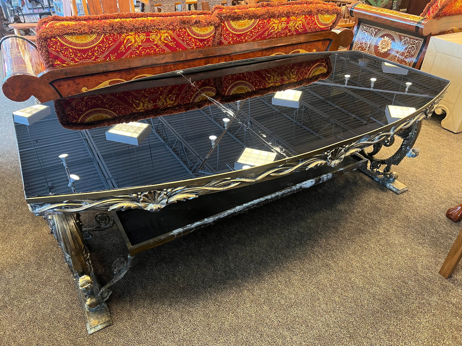 Glass Top Bronze/Brass Table: Glass Top Bronze/Brass Table w/dolphins. Mid Century Modern era. Glass top is broken into 2 pieces. Extremely heavy.