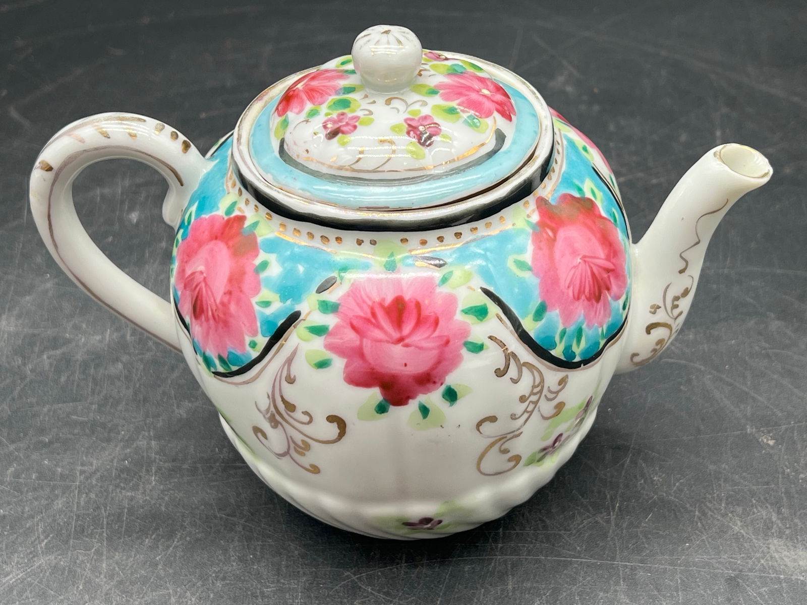 Pip Studio Floral Teapot: Pip Studio Floral Teapot. Vibrant pink roses and gold decorative accents