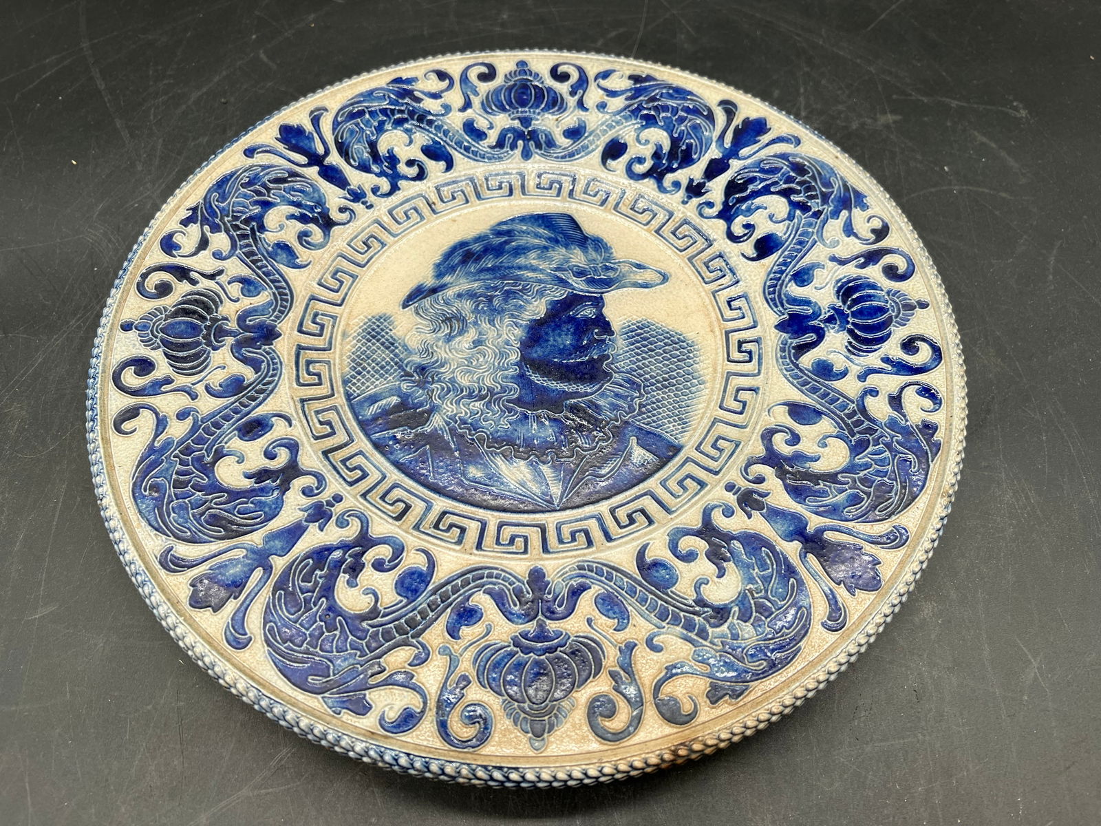 Blue/Gray Wall Plaque with Hook: Blue/Gray Wall Plaque with Hook. Man in center