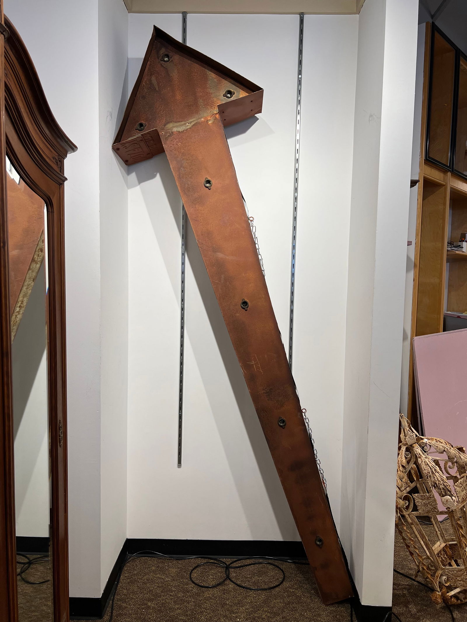 Metal Arrow Sign: Metal Arrow Sign. Some metal has been replaced with license plates. Has not been tested