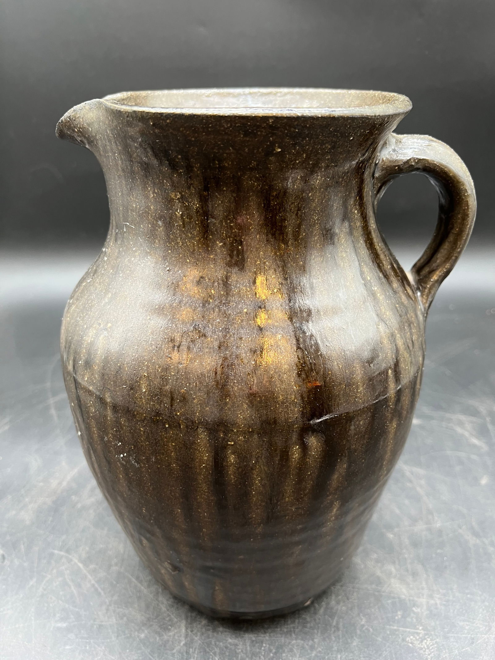 Signed Hewell Pottery Stoneware Pitcher: Signed Hewell Pottery Stoneware Pitcher. Signed Chester Hewell 1997. Brown glaze