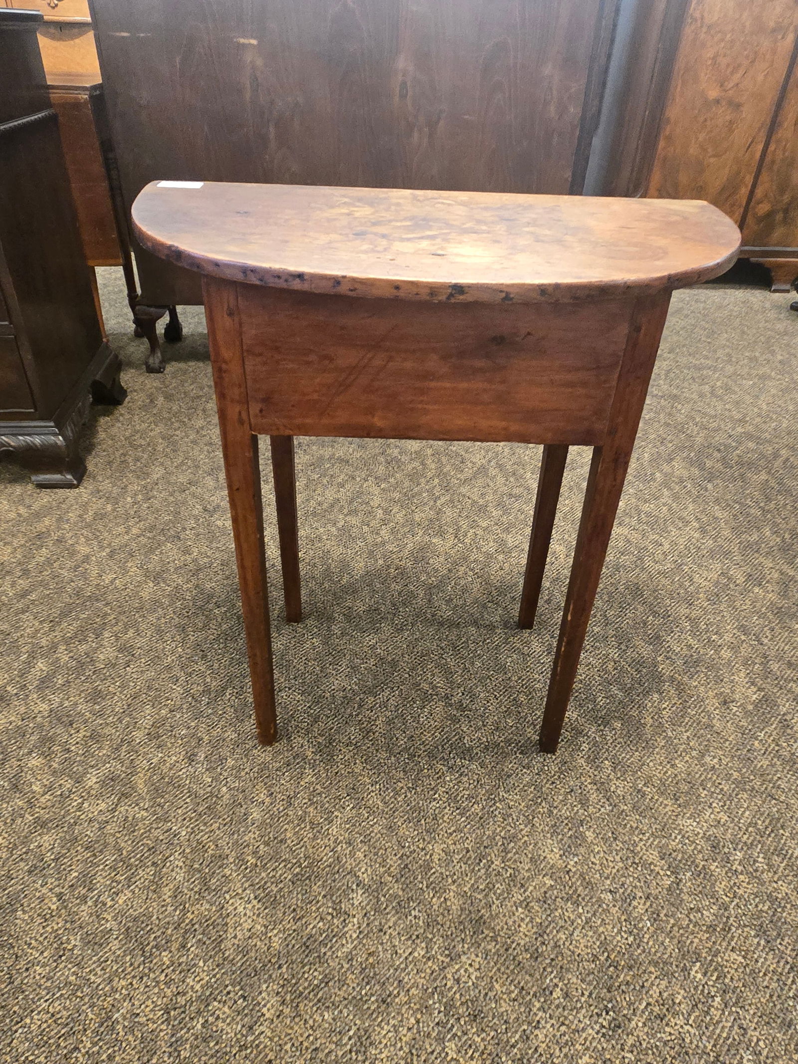 Early primitive pine table: Early primitive pine table. Square base with half round top. Tapered legs wooden pegged construction. Tennessee estate.