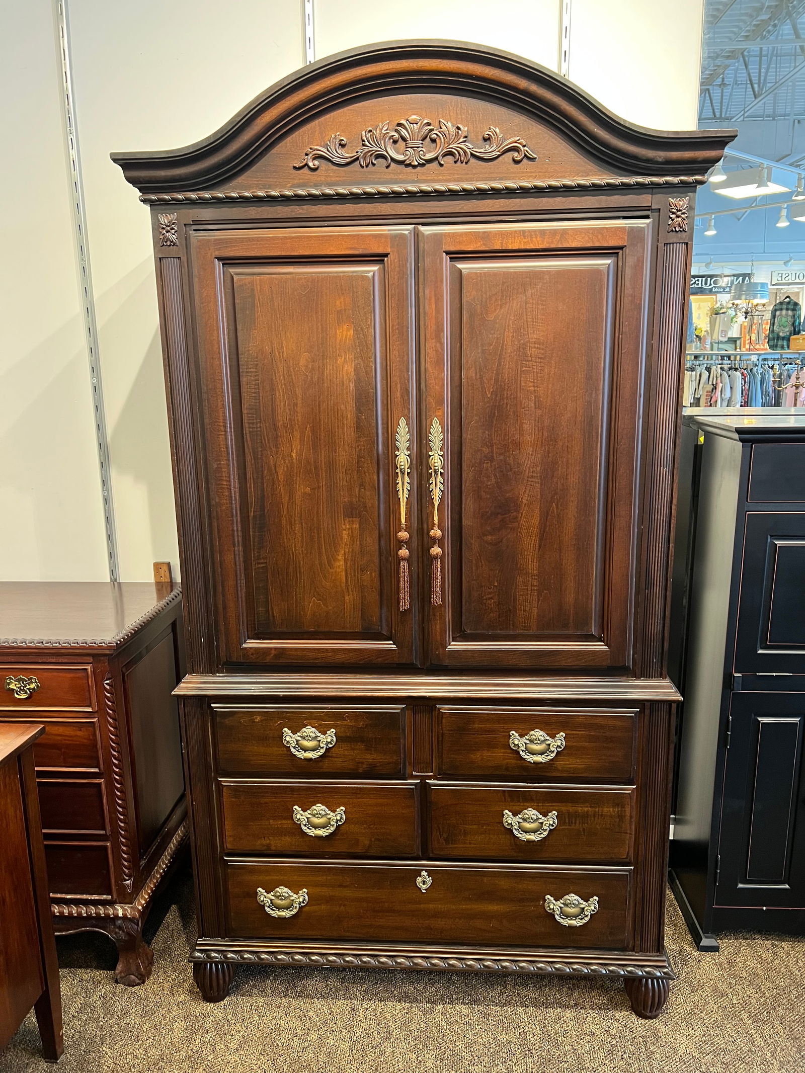 Kincaid Mahogany Entertainment Cabinet: Kincaid Mahogany Entertainment Cabinet. Decorative handles. 5 drawers on the bottom