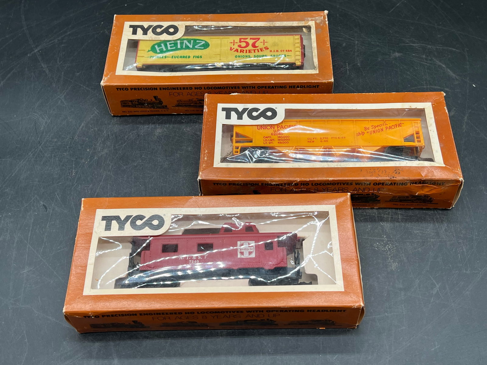 Lot of 3 Tyco HO Scale Train Cars: Lot of 3 Tyco HO Scale Train Cars. Hopper car, Heinz 57 box car, and caboose