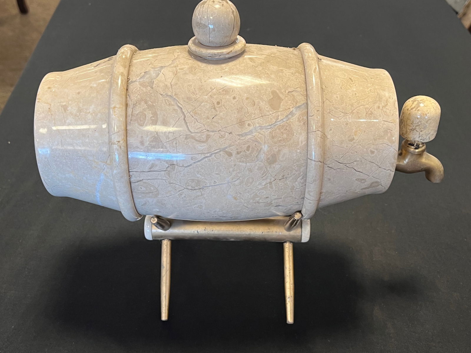 Stoneware Dispenser on Brass Stand: Stoneware Dispenser on Brass Stand.