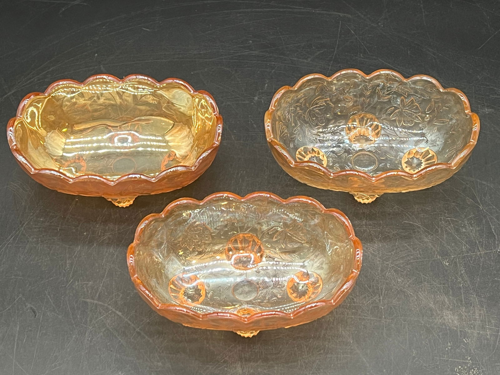 Lot of 3 Carnival Glass Footed Oval Dishes: Lot of 3 Carnival Glass Footed Oval Dishes. Jeanette Floragold - Iridescent Pattern