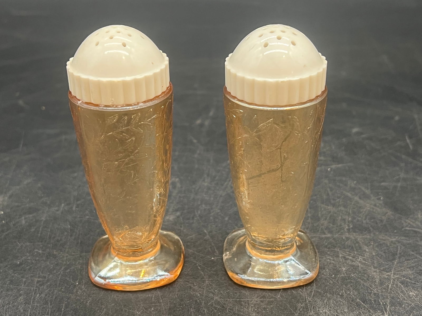 Carnival Glass Salt and Pepper Shakers with Bakelite Lids: Carnival Glass Salt and Pepper Shakers with Bakelite Lids. Jeanette Floragold - Iridescent Pattern