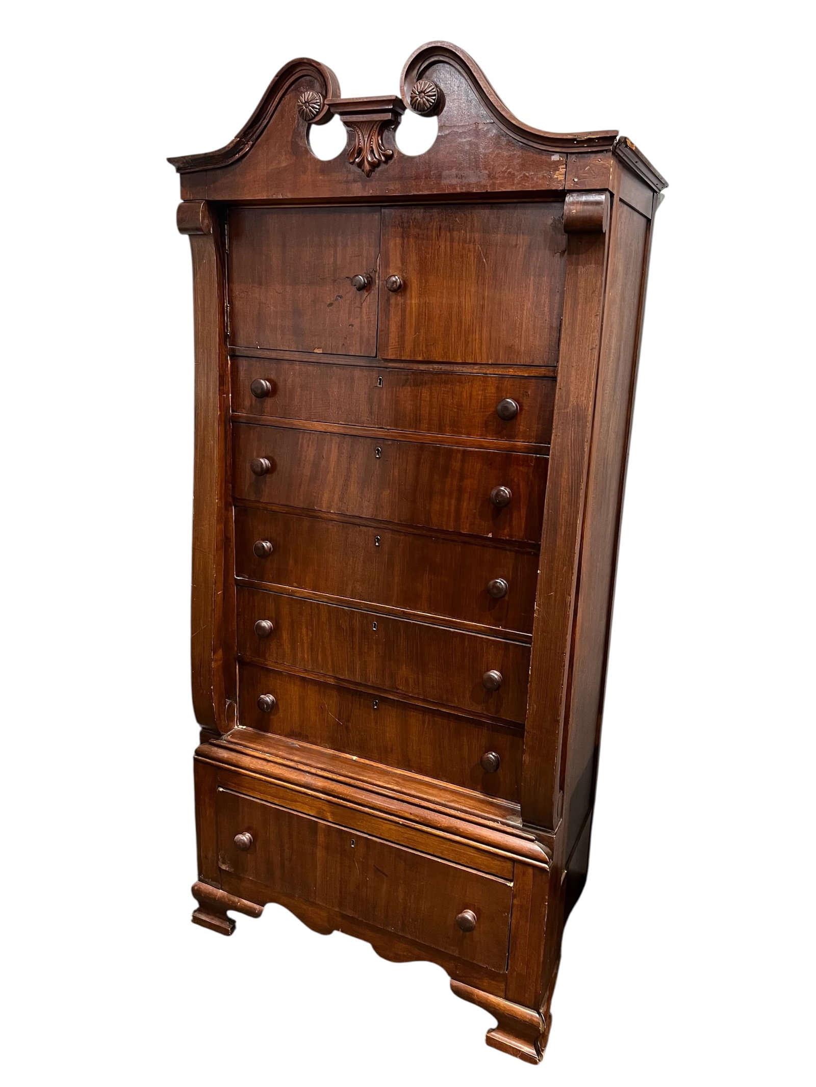 Antique Empire Style Mahogany Chest: The furniture piece shown in the image is an antique chest-on-chest, also commonly referred to as a tallboy. This specific example appears to be a 19th-century mahogany piece, likely in the Victorian 