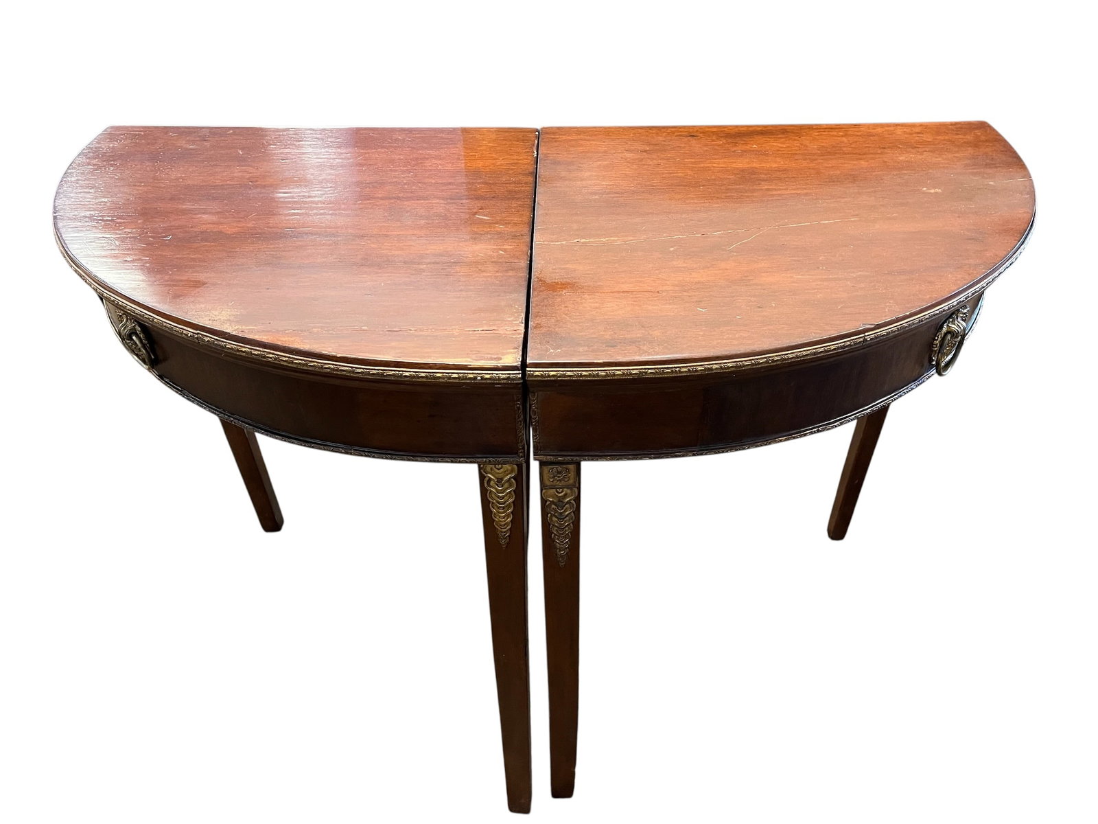 Pair of Edwardian Style Demilune Console Tables: This piece of furniture is a demilune console table, specifically designed in the Federal or George III style. The name "demilune" refers to its crescent or half-moon shape, which allowed these tables