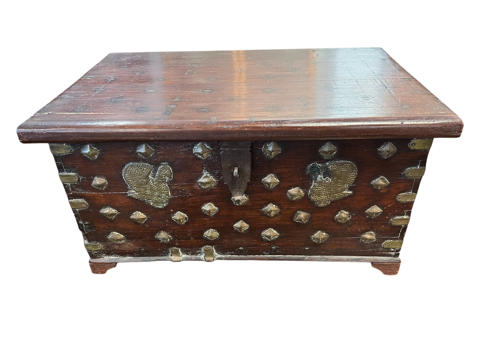 Unique Wooden Chest With Brass Studs: This antique chest shares visual characteristics with a variety of historical storage pieces, most notably 19th-century Indian brass-mounted trunks and Zanzibar chests Measures 11 in tall x 21 in wide