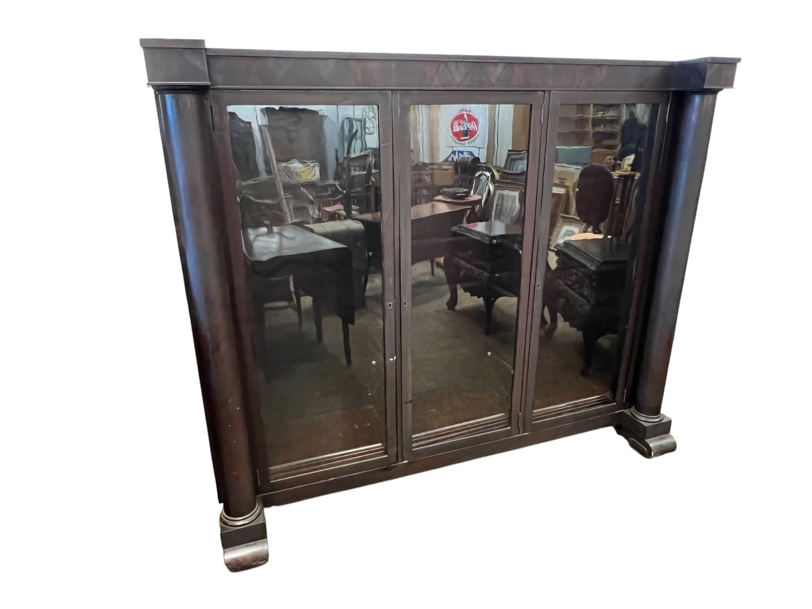 Antique Mahogany Double Door Bookcase: This is an antique American Empire or Victorian triple bookcase, likely crafted in the style of R.J. Horner & Co. around 1900. Design Details: It features a rich dark wood finish, possibly carved oak 