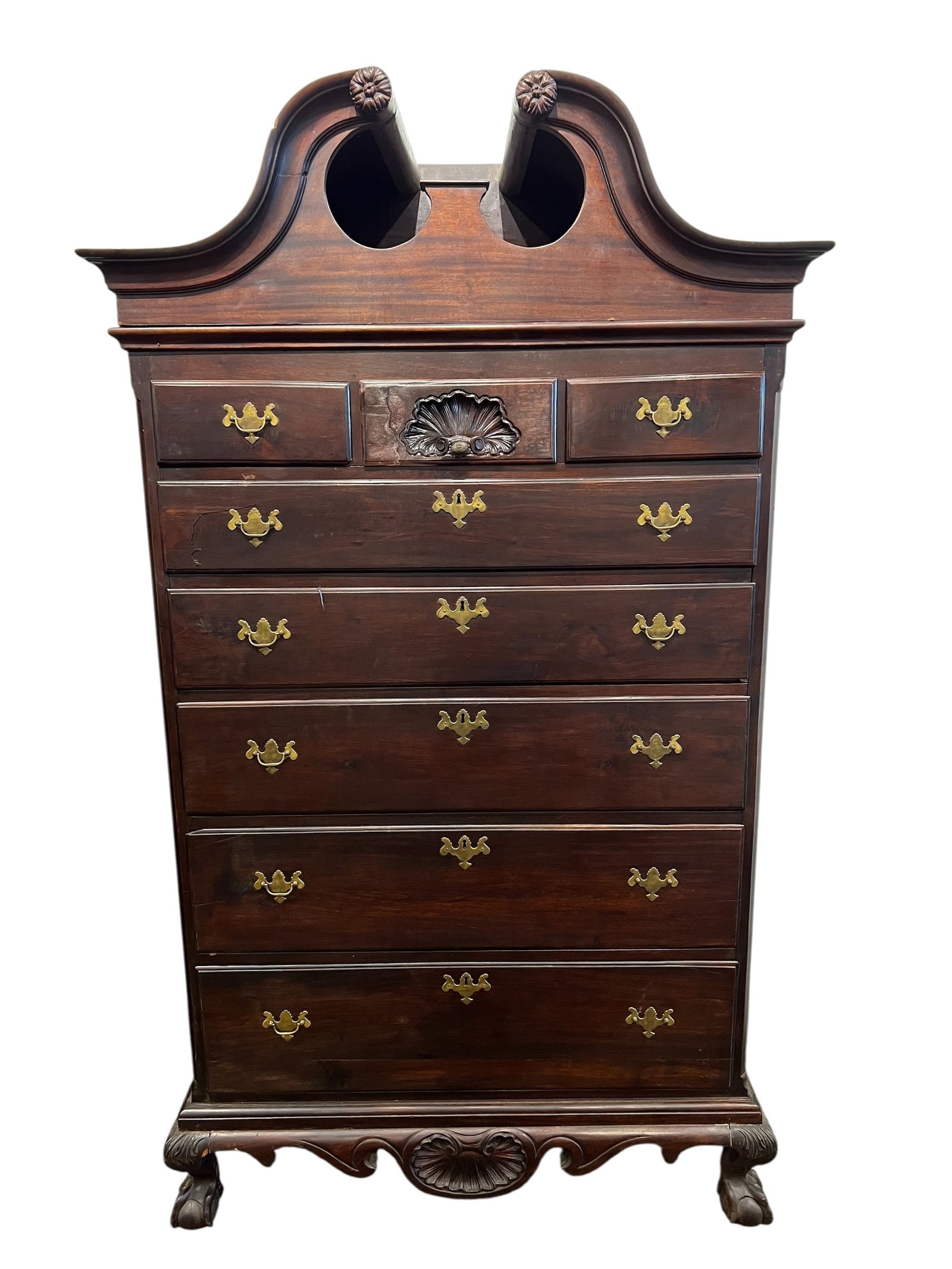 Satton Furniture Cherry Bonnet Top Chest on Chest: This is a Statton Chippendale style cherry chest on chest.This piece is crafted from cherry wood and features traditional brass hardware.It is designed in the Chippendale style, characterized by a bon