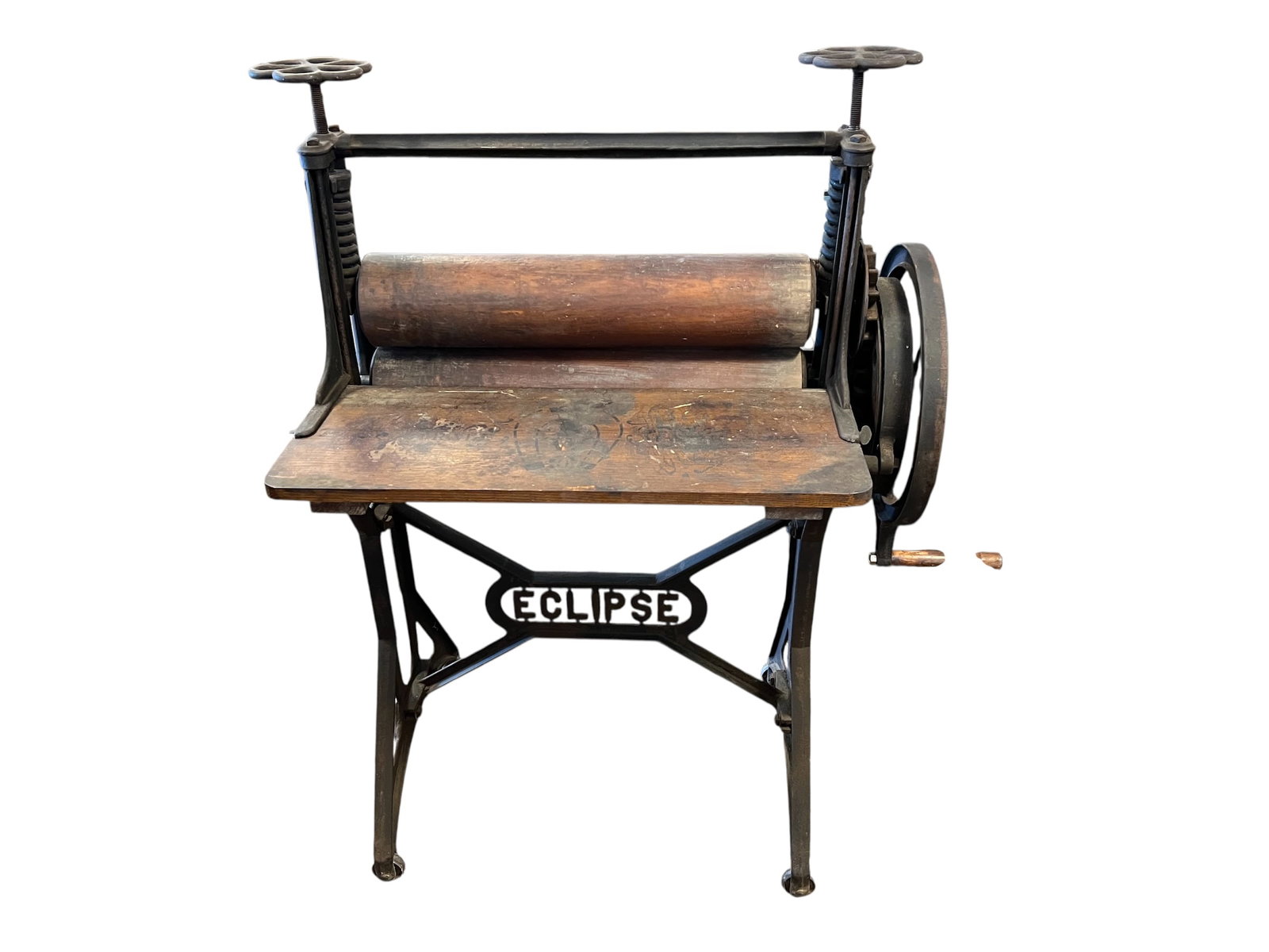 Laundry Press: This is an antique "Eclipse" brand clothes wringer or mangle press featuring a cast iron frame and wooden rollers. [1, 2]Function: Used primarily for pressing linen smooth or squeezing water out of