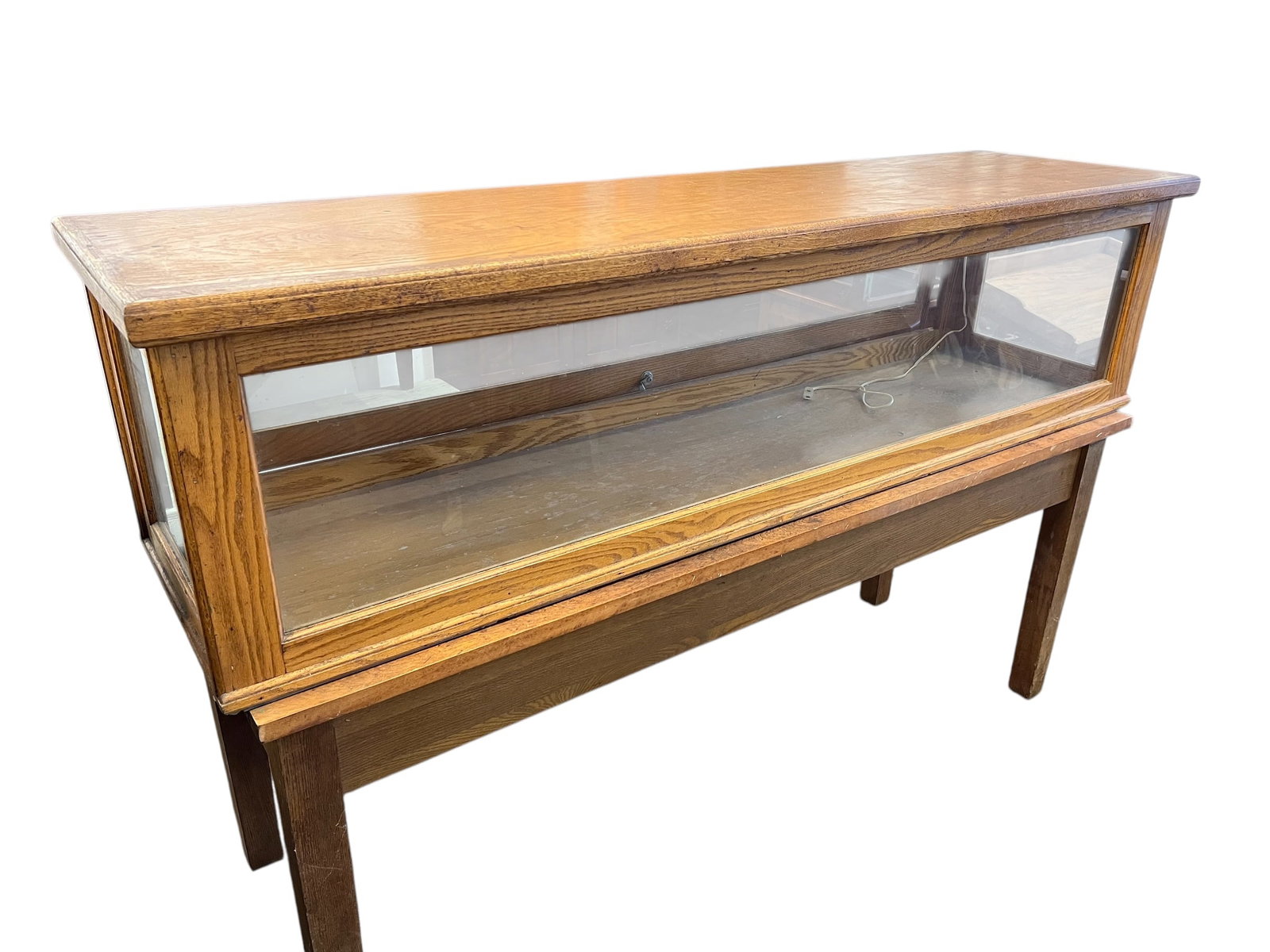 Antique Oak Display Case: This item is an antique oak display case, often referred to as a country store showcase or a barrister-style display section.These cases were commonly used in the early 20th century for retail display