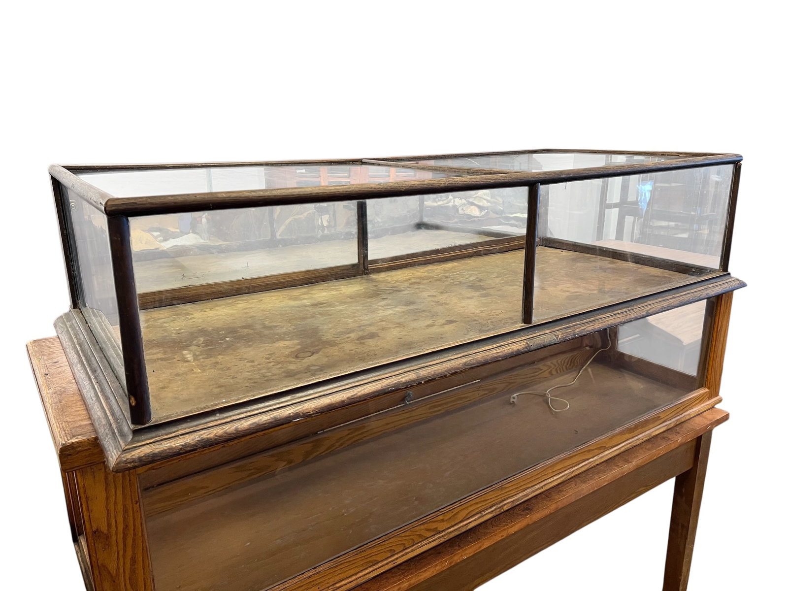 Counter Top Display Case: This antique display case is a vintage oak and glass countertop showcase, likely dating to the early 20th century (circa 1900-1920). These were standard fixtures in country stores and mercantile shops