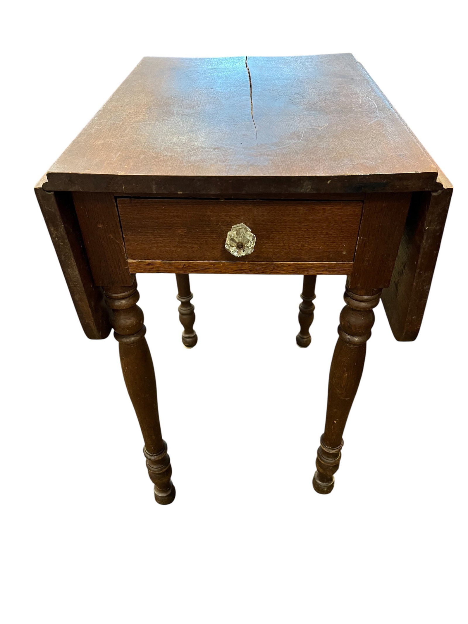 Walnut 1 Drawer Dropleaf Stand: This image shows an antique drop-leaf table, specifically a style often called a Pembroke table, which was popular in the 18th and 19th centuries. These tables are characterized by two side flaps that