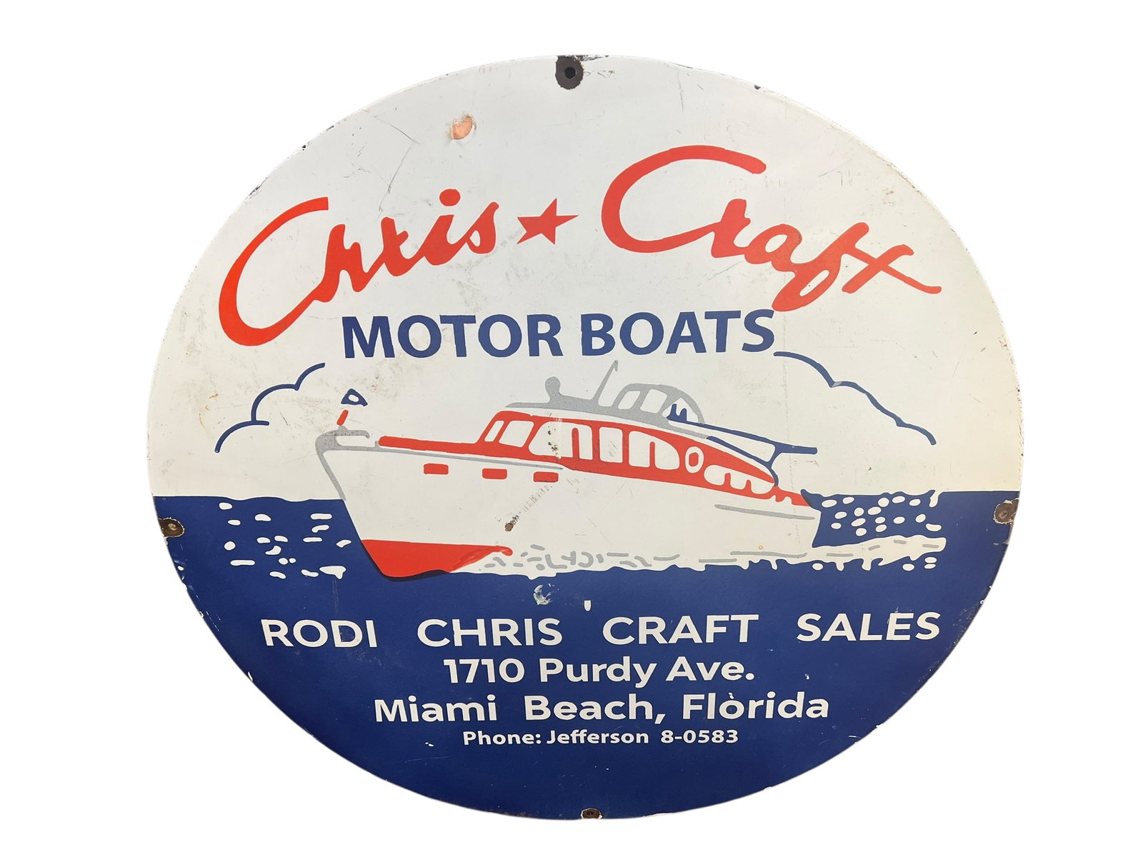 Chris Craft Metal Advertising Sign: This is a vintage round Chris-Craft Motor Boats porcelain advertising sign from a Miami Beach dealership. [1, 2]Design: Features a stylized cabin cruiser boat with blue and red details, along with the