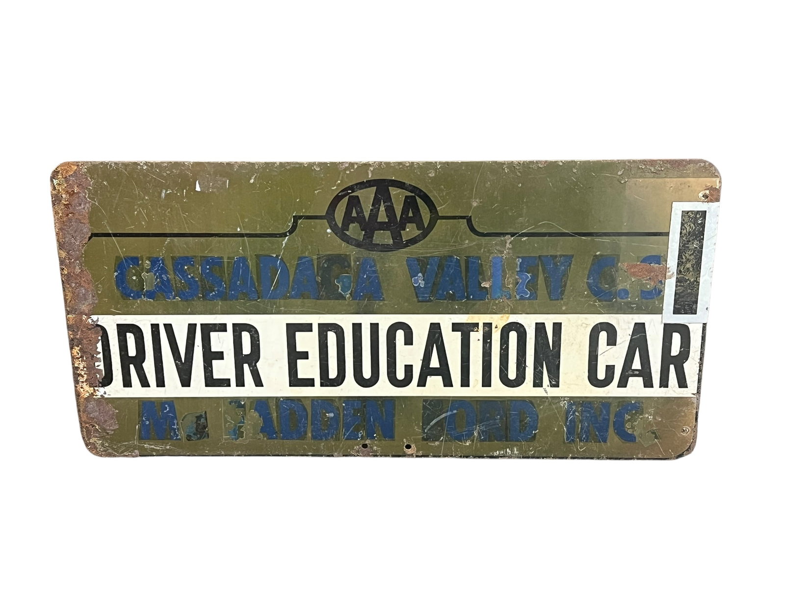 AAA Driver Education Metal Advertising Sign: This is a vintage mid-century metal AAA driver's education car sign from Cassadaga, New York. [1]The sign features lettering advertising "Cassadaga Valley C.S." and a local Ford dealership, "McFadden 