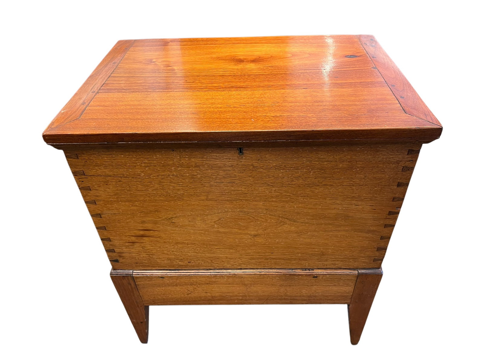 Sugar Chest: This is an antique Southern Federal walnut sugar chest on a stand, dating to the early 19th century (circa 1810). It is characterized by its rectangular form, a hinged lid with a mitered or breadboard