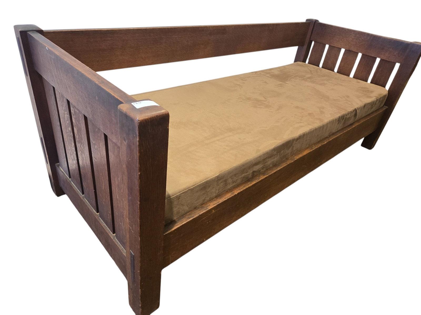 Signed Gustov Stickley Sofa: This is a Stickley Mission-style settle sofa featuring a solid quarter-sawn oak frame and vertical slat sides. [1, 2]Design Style: This furniture piece is designed in the Arts & Crafts or "Mission"