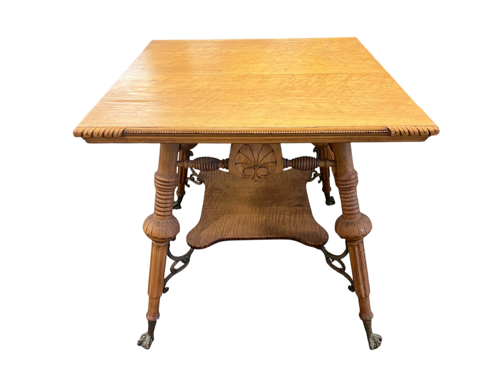 Bird’s Eye Maple Table: This is an antique Victorian-style table made of quarter-sawn oak, featuring turned legs and glass ball-and-claw feet. [1, 2]Materials & Design: The table is crafted from solid oak and showcases a