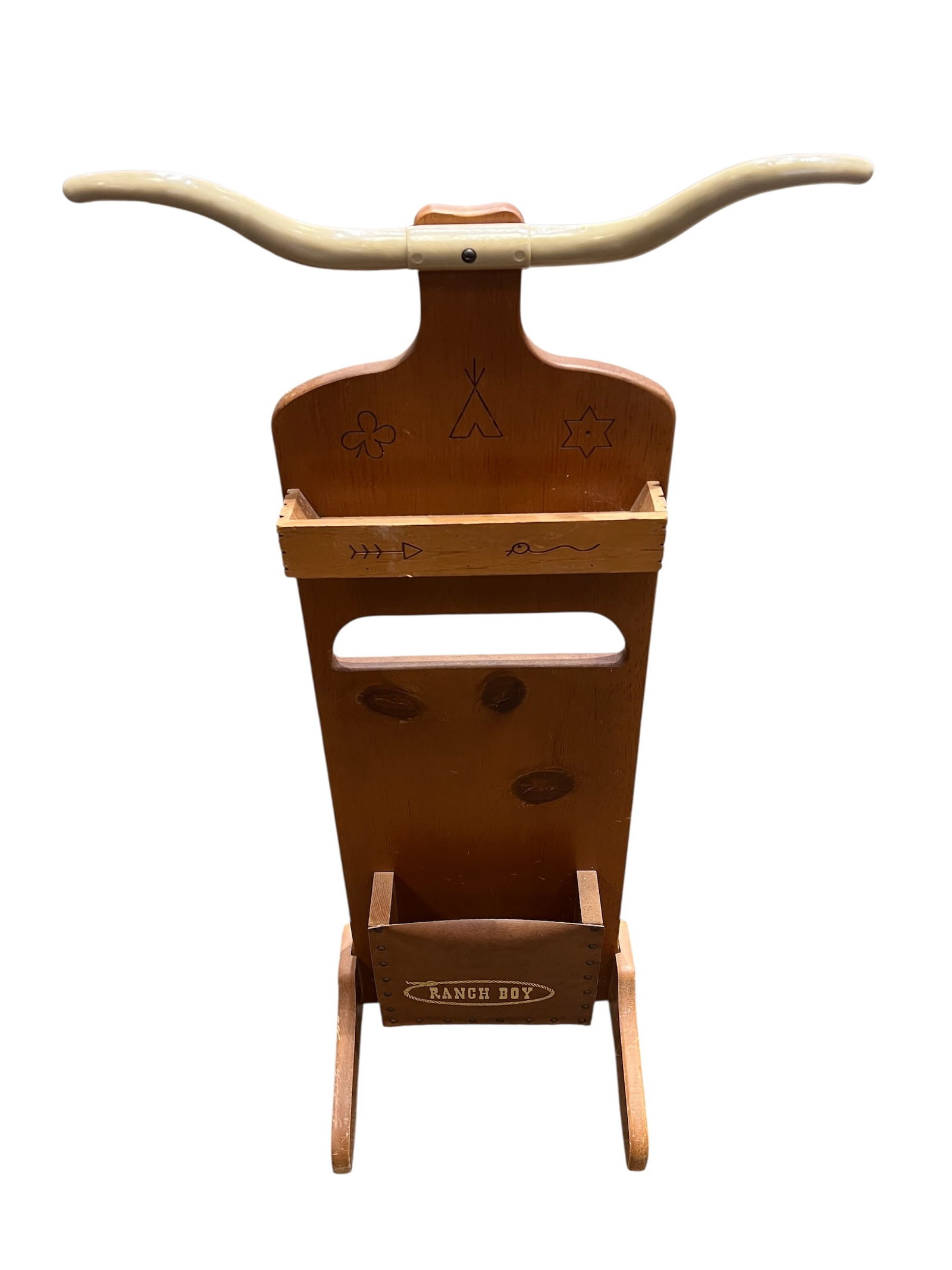 vintage 1950s child-sized cowboy valet stand: This object is a vintage 1950s child-sized cowboy valet stand. It is commonly known as the "Ranch Boy" western valet. [1]Key FeaturesPurpose: It was designed for children to hang clothes, store