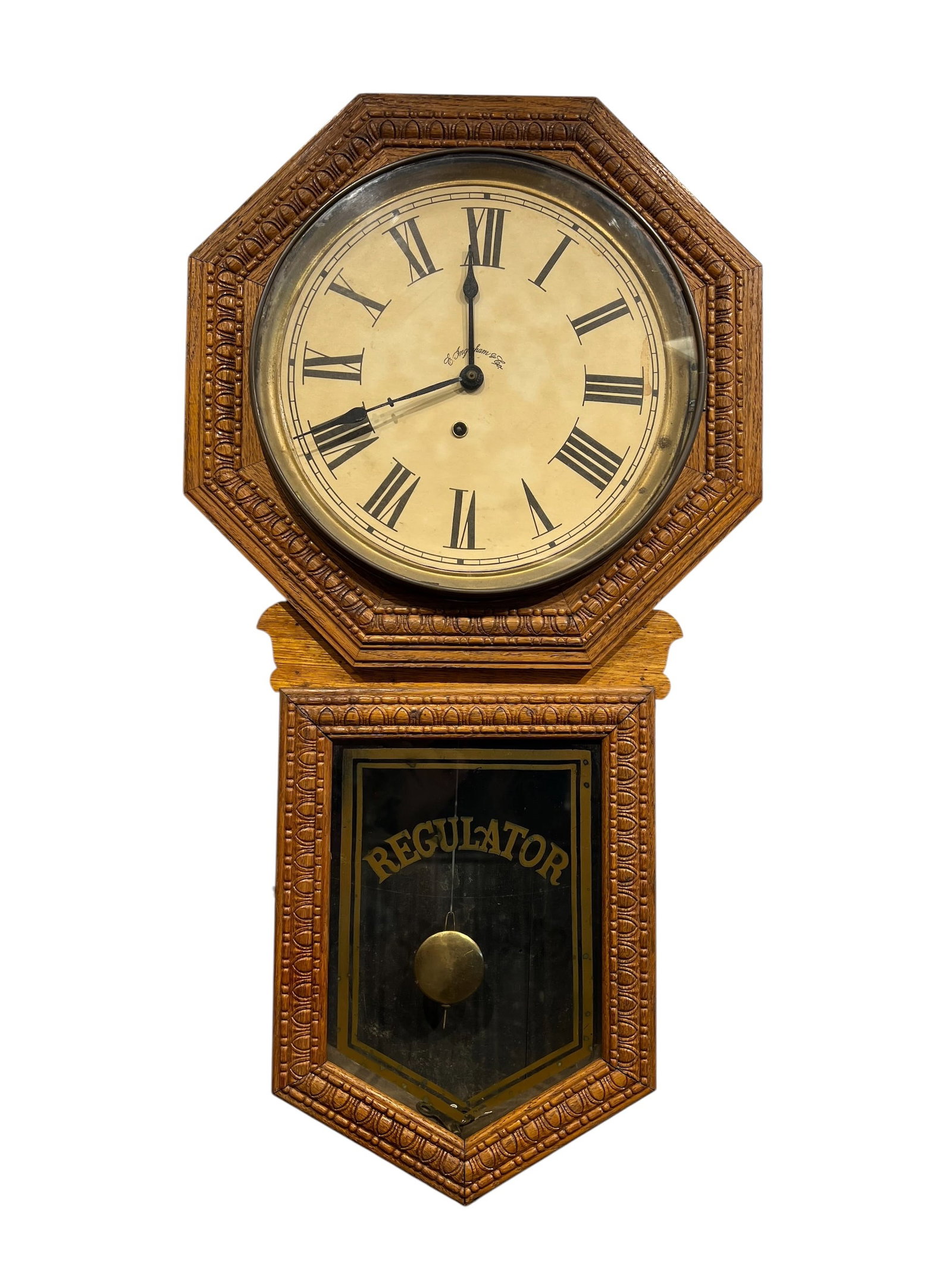 Regulator Wall Clock: This item is an antique Sessions school house wall clock featuring a pressed oak case and a brass pendulum. [1, 2]Manufacturer: Sessions Clock Company of Forestville, Connecticut.Design: The clock fea