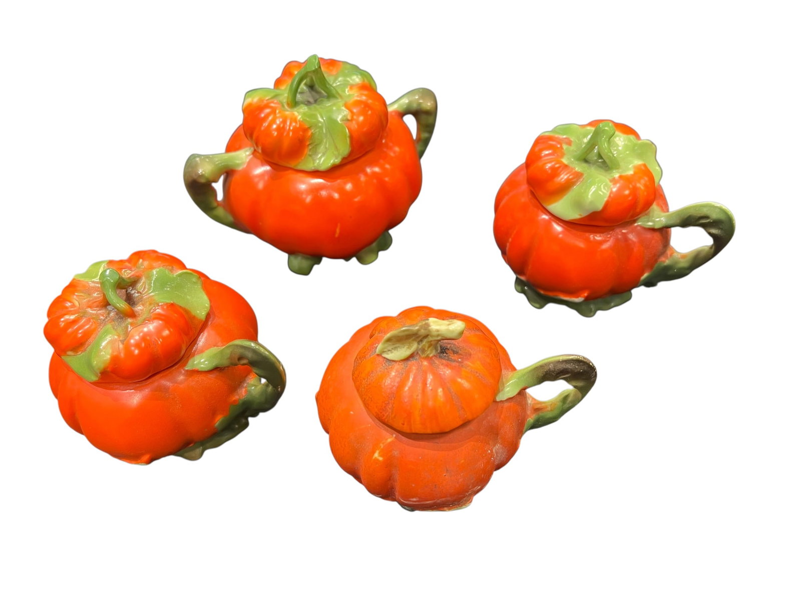 Lot of 4 Royal Bayreuth China: This image displays an antique Royal Bayreuth figural tomato table set, produced in Bavaria, Germany, primarily during the early 1900s. Crafted from painted porcelain, this iconic "Tomato Ware" patter