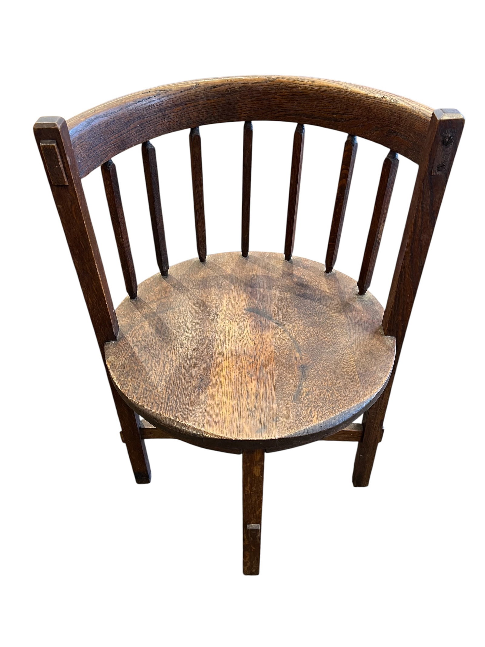 Barrel Chair: This is a Liberty & Co. 'Stanmore' oak Arts & Crafts corner chair from circa 1900.This style is often referred to as a "barrel chair" or "tub chair" because of its curved, enclosed back.The chair