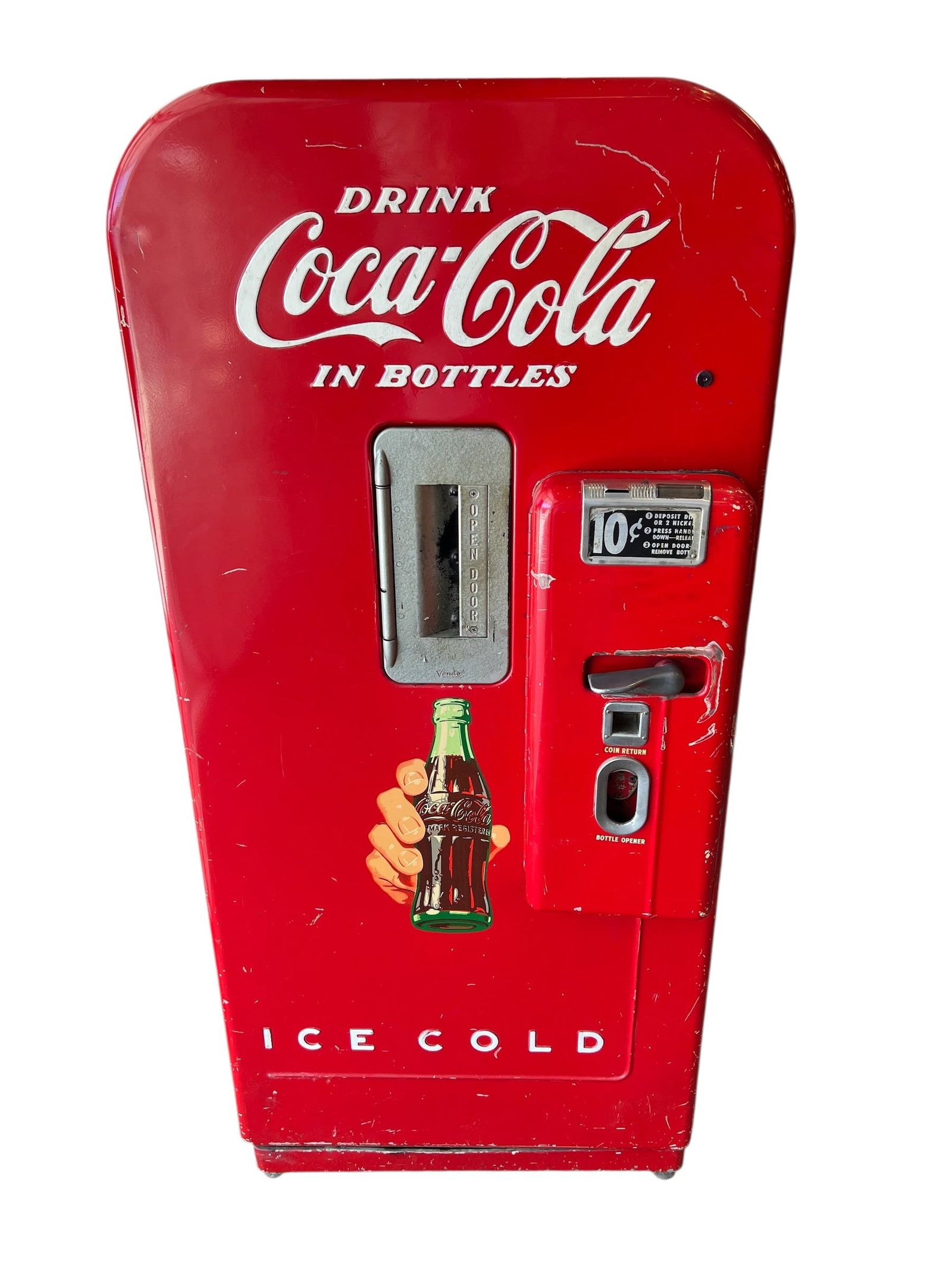Early Vendo 39 Coca Cola Machine: This is a vintage Vendo 39 Coca-Cola vending machine, likely manufactured between the late 1940s and early 1950s, which dispensed 6 or 8-ounce glass bottles. [1, 2, 3]The machine has a capacity of 39
