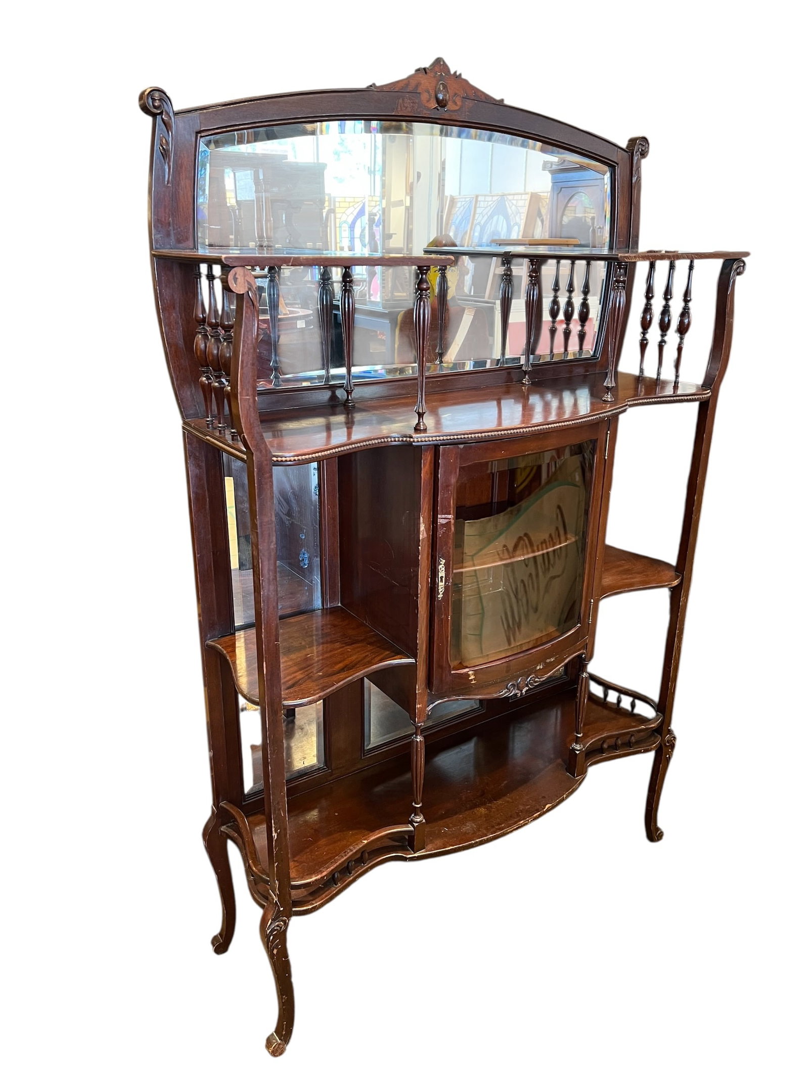 Antique Victorian Mahogany Etagere: This is an antique Victorian mahogany etagère with a bowed glass curio cabinet. [1, 2]Materials & Style: The piece is crafted from dark-finished mahogany wood in a Victorian or Art Nouveau style,