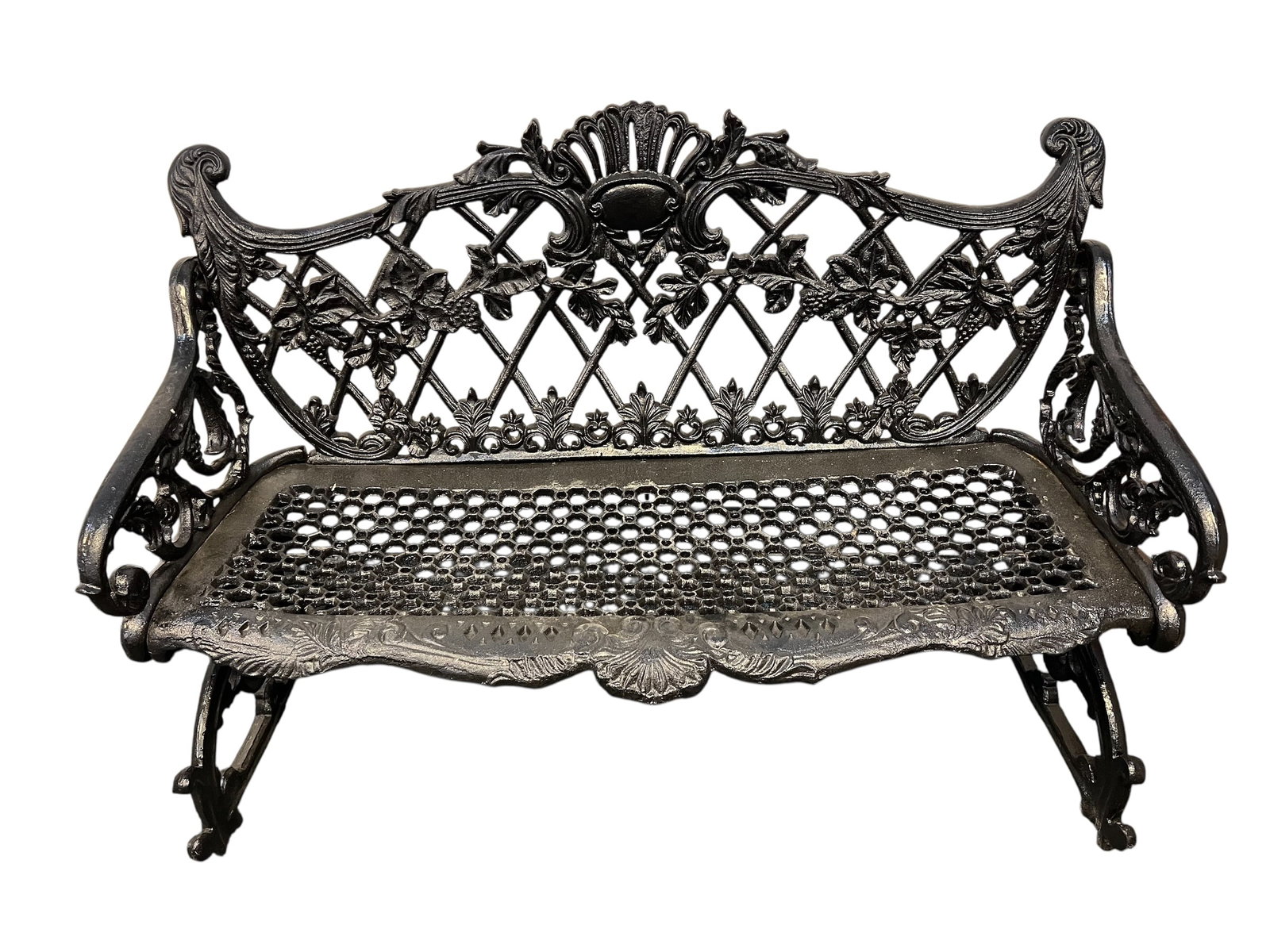 Cast iron bench: Victorian-style cast iron garden bench, famously referred to as the "Betsy Ross" or "Grapevine" pattern. It features a highly ornate backrest detailed with intertwining grapevines, leaves, and cluster