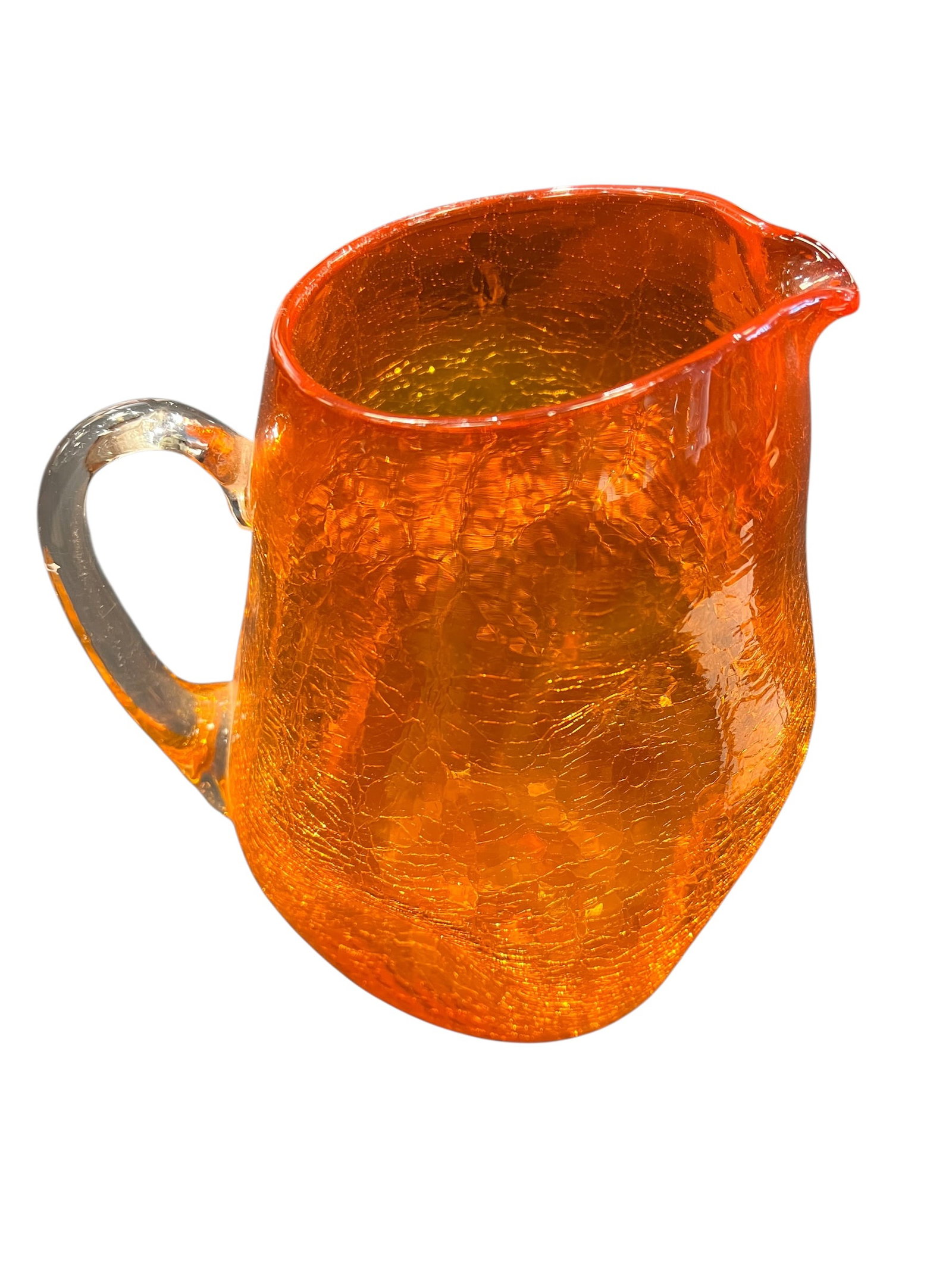 vintage Blenko or Pilgrim orange crackle glass pitcher: This item is a vintage mid-century modern crackle glass mini pitcher, produced primarily in the 1960s by renowned West Virginia art glass companies like Pilgrim Glass or Blenko Glass. It features a di