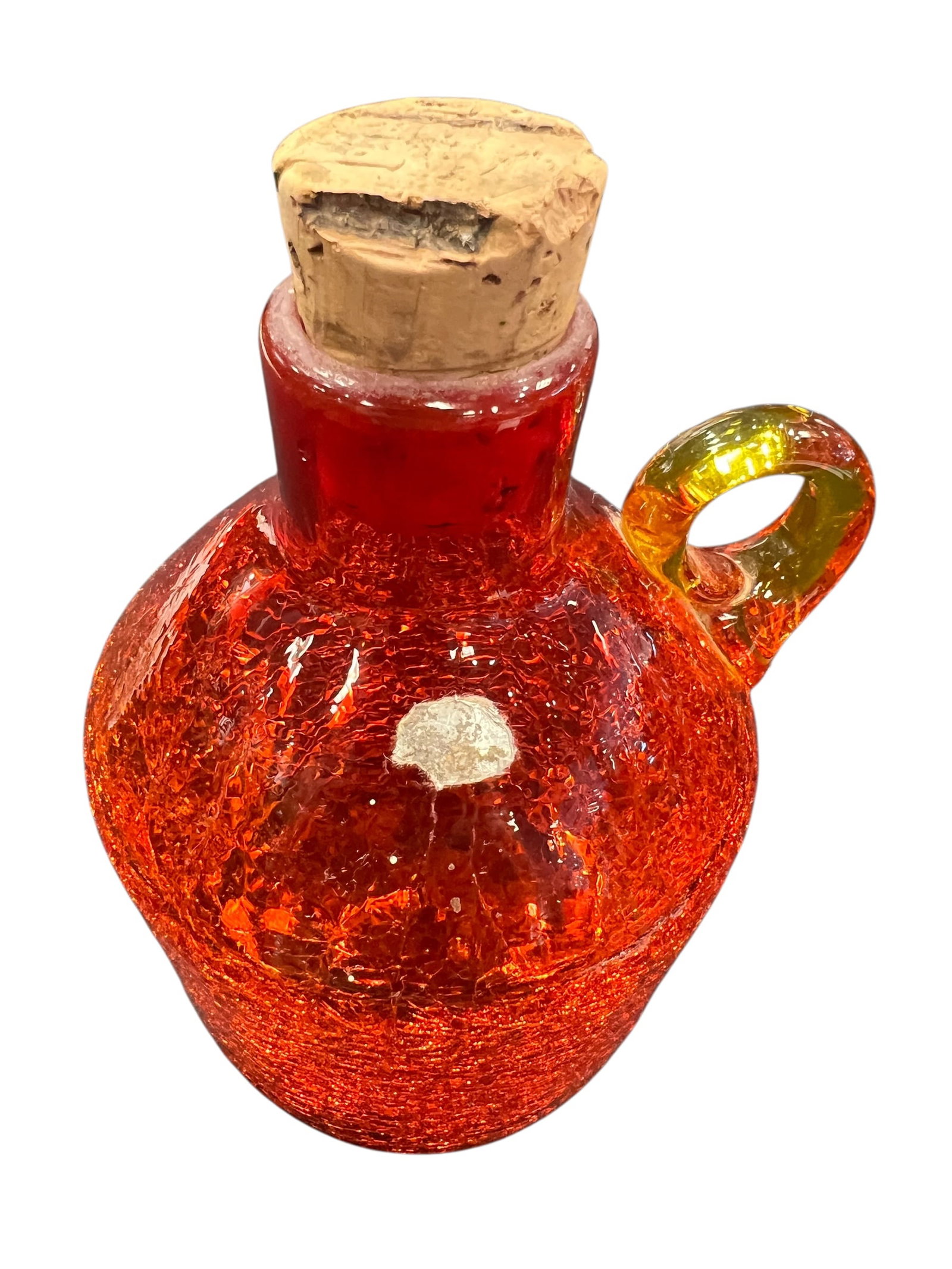 vintage Rainbow Art Glass crackle glass moonshine jug: This item is a vintage mid-century modern crackle glass moonshine jug, traditionally crafted in the Appalachian region. The piece features a vibrant "Amberina" gradient that transitions from a fiery r