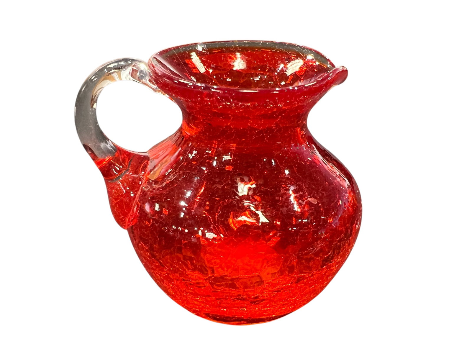 vintage handmade red crackle glass mini pitchers: These are vintage handmade red crackle glass mini pitchers, often produced by companies like Pilgrim or Kanawha in the mid-20th century. [1, 2]Design Characteristics: They feature a distinctive textur