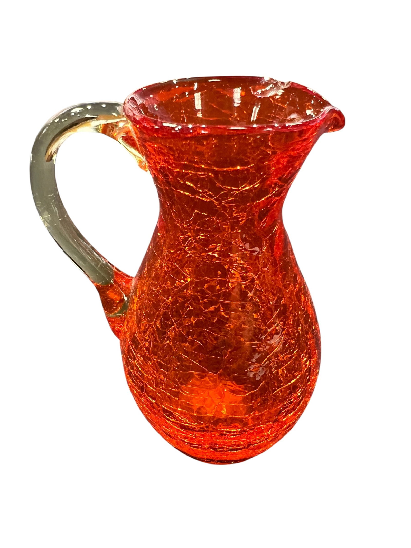 vintage Pilgrim Glass Amberina crackle glass pitcher: This is a vintage Pilgrim Glass Amberina crackle glass pitcher with an orange and yellow ombre effect and a clear applied handle. [1, 2]Production Method: This piece is hand-blown and features a disti