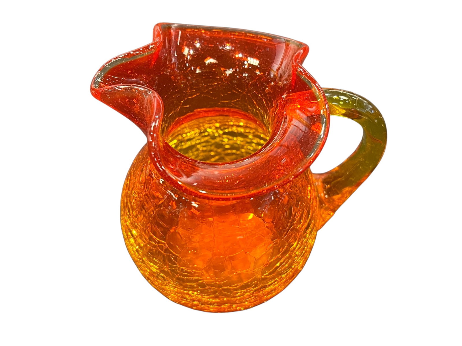 vintage amber crackle glass pitcher or basket: This item is a vintage mid-century modern hand-blown crackle glass basket featuring a vibrant orange/tangerine hue and an applied clear glass loop handle. [1, 2]Key Characteristics & IdentificationSty